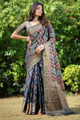 Model wearing organza leheriya zari woven saree